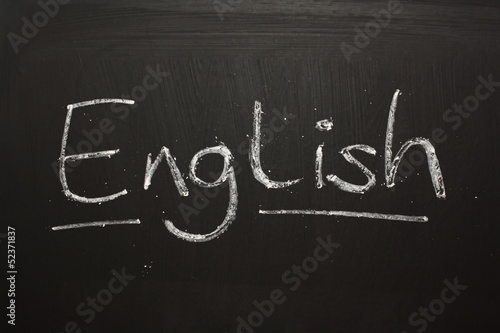 The word English handwritten on a blackboard