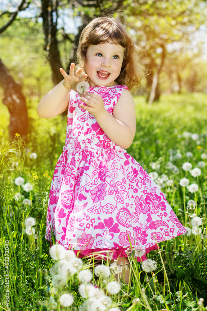 child girl at dandelion meadow in summer child girl at dandelion meadow in summer