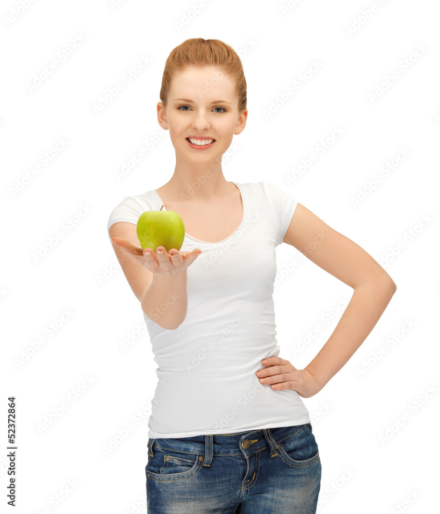 woman in blank t-shirt eating green apple woman in blank t-shirt eating green apple