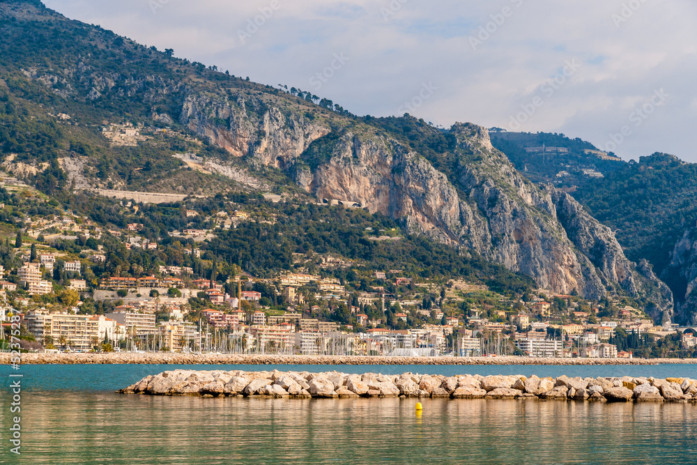 View of Ligurian Alps and Menton city from the Mediterranean Sea