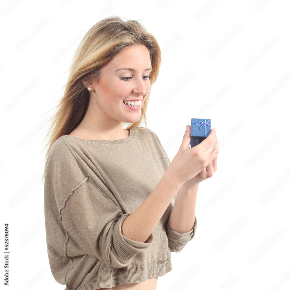 Pretty woman smiling and opening a gift box Pretty woman smiling and opening a gift box