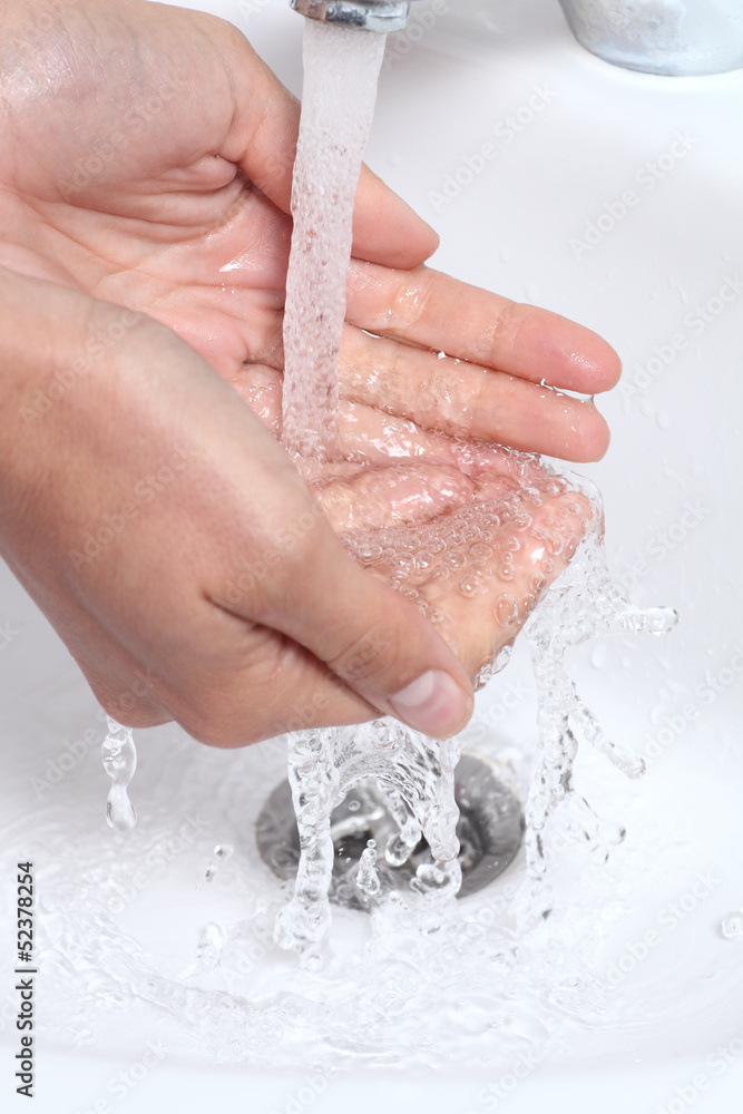 Fototapeta premium Woman hands under a waterjet