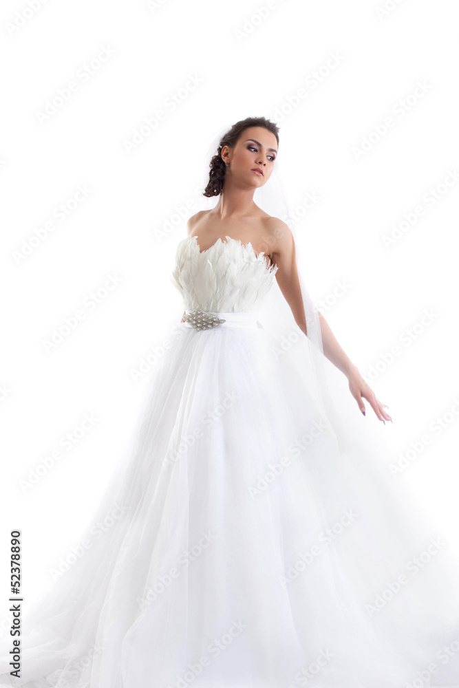 Young beautiful bride posing in fashionable dress