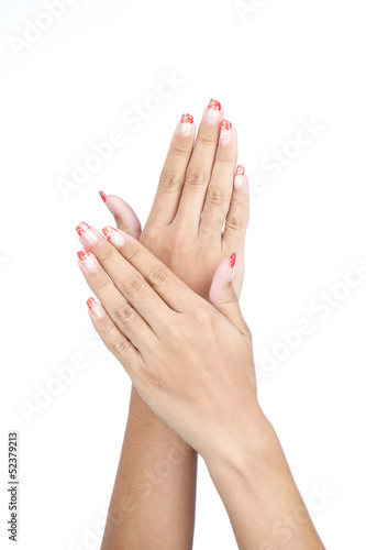 female s hands with nice manicure isolated on white background