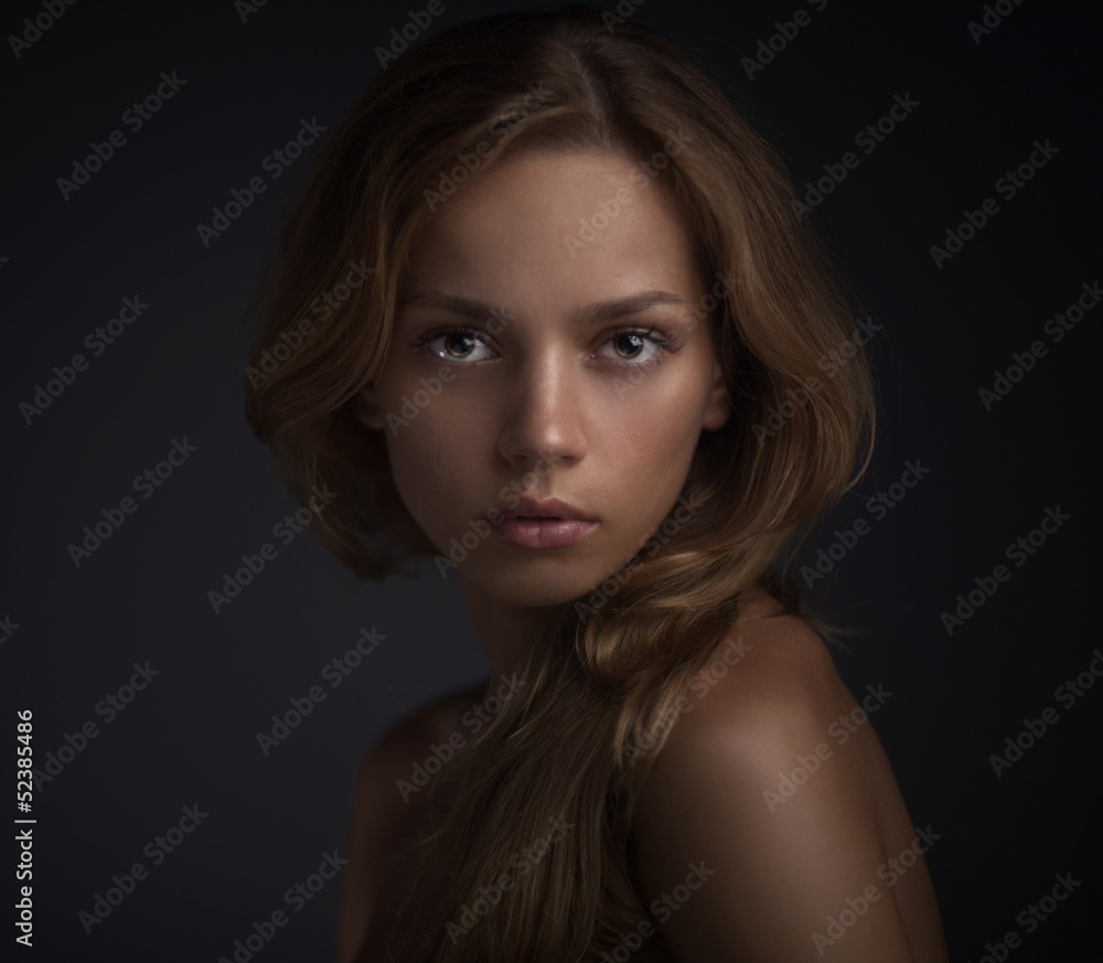portrait of young woman on dark backround portrait of young woman on dark backround