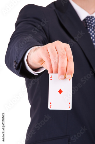 Businessman showing playing card.