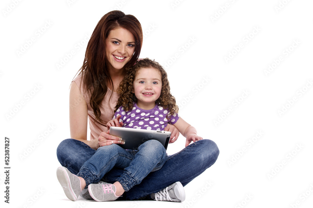 Mother and daughter using a computer tablet Mother and daughter using a computer tablet