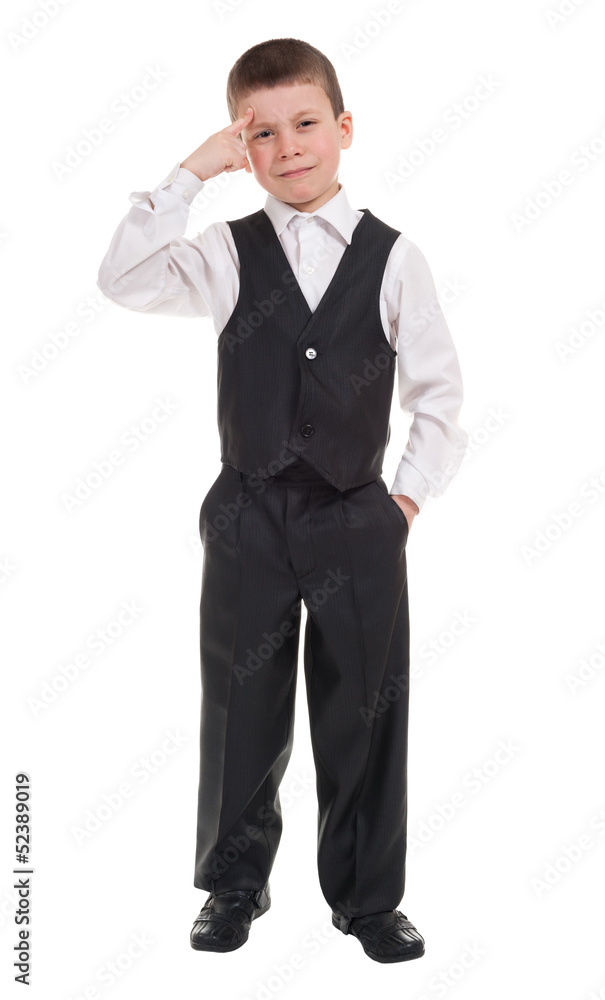 boy touching finger to his forehead boy touching finger to his forehead