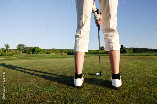 Golf serie, woman playing golf on a course