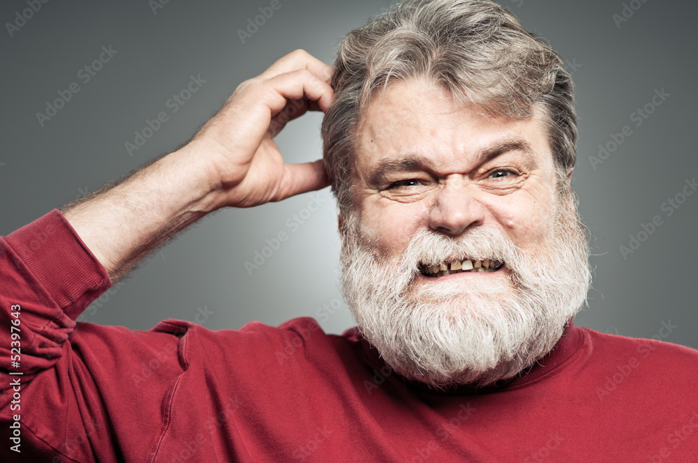 Obraz premium Mature Caucasian Man Scratching His Head Like He Forgot Somethin