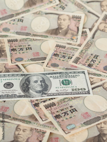 100 US dollar note isolated on Japanese yen note background