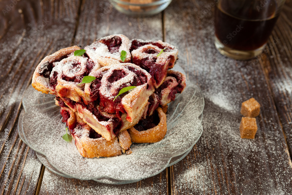 small cherry buns with powdered sugar small cherry buns with powdered sugar