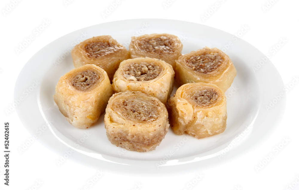 Sweet baklava on plate isolated on white
