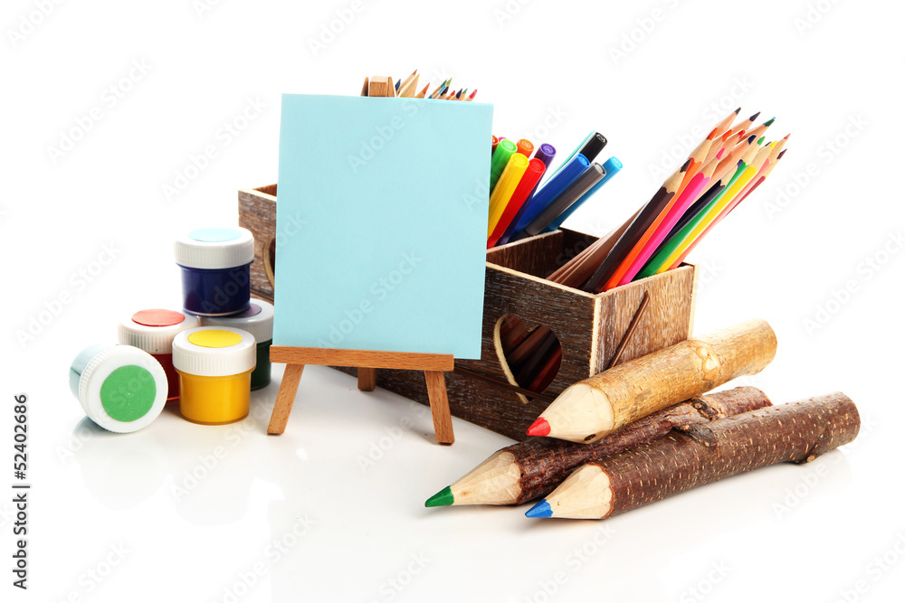 Different pencils in wooden crate, paints and easel, isolated Different pencils in wooden crate, paints and easel, isolated