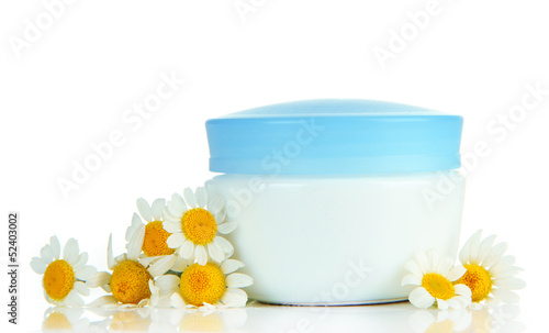 Cosmetic cream with wild camomiles  isolated on white