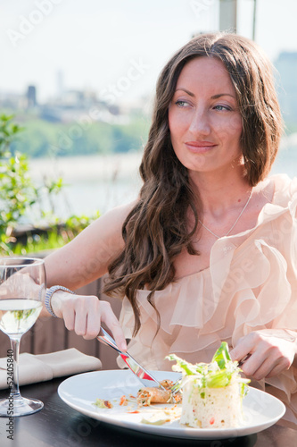Pretty young girl enjoying the salad