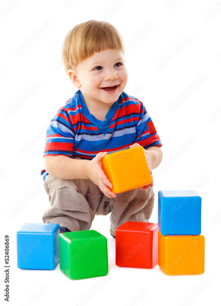 Little boy playing with colorful cubes Little boy playing with colorful cubes