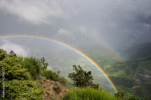 Fototapeta Naklejka Na Ścianę i Meble -  Double rainbow over hills