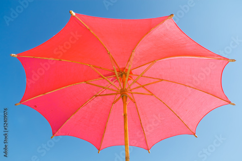 Pink umbrella  made of paper.