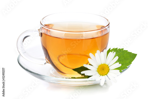 Cup of tea with mint leaves and chamomile flower