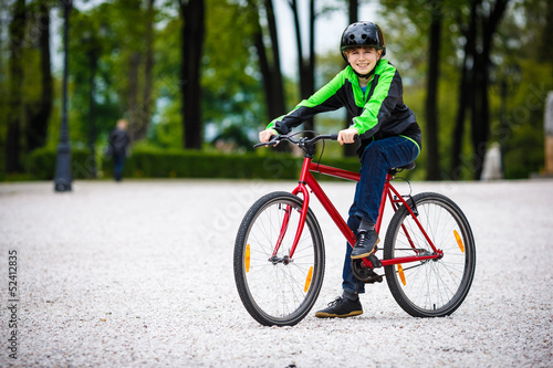 Urban biking - teenage boy and bike in city