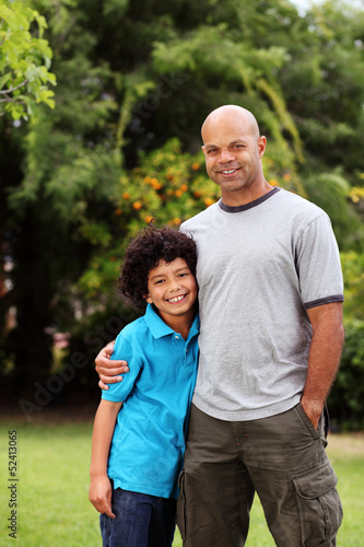 Happy and relaxed mixed race father and son