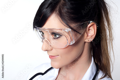 Portrait of female doctor with protective glasses