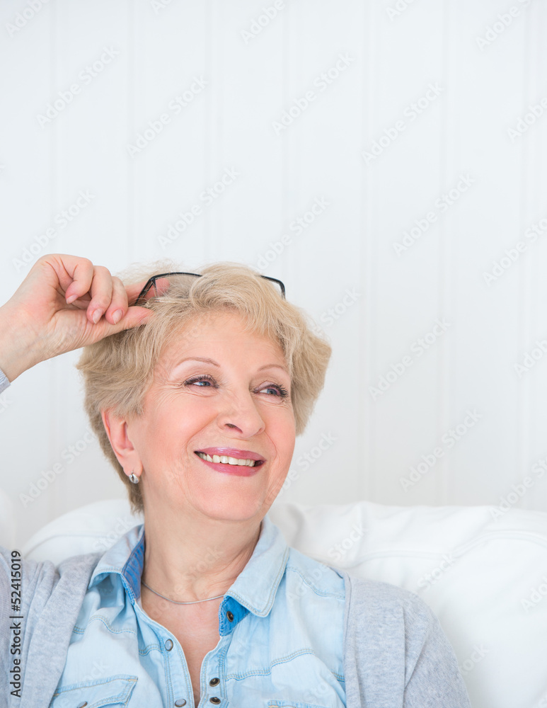 Senior woman portrait, at home with white hair