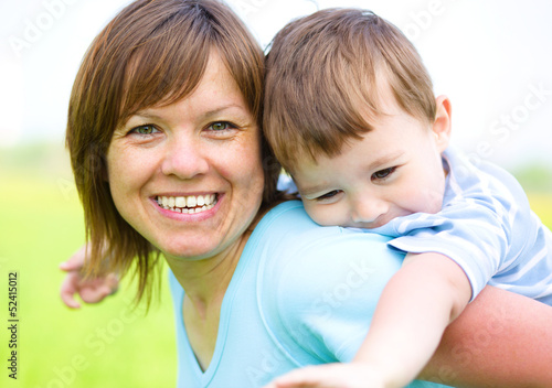 Mother is playing with her son