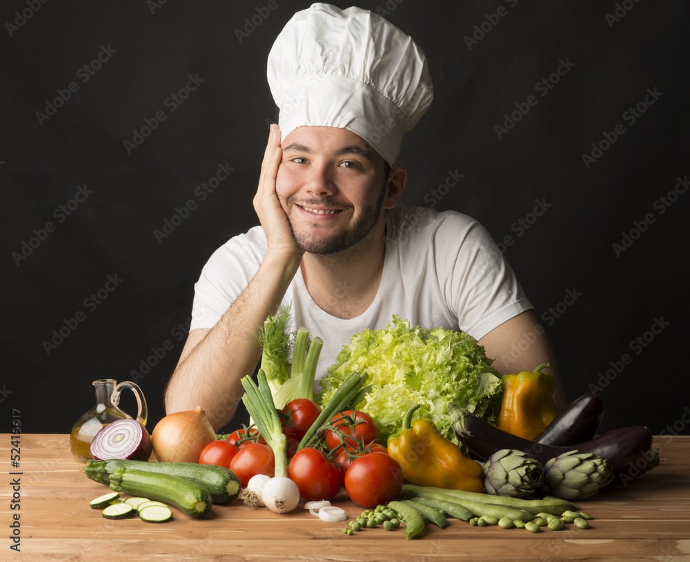 cook with vegetables on black background cook with vegetables on black background