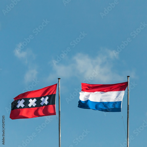 Canvas Print The Dutch national flag and the official flag of Amsterdam