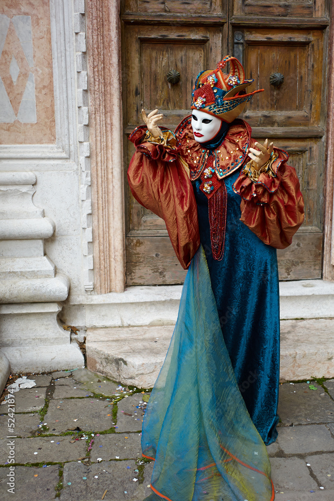 Venetian costume attends Carnival of Venice.
