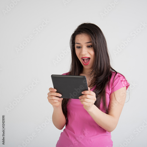 beautiful woman is pleased tablet