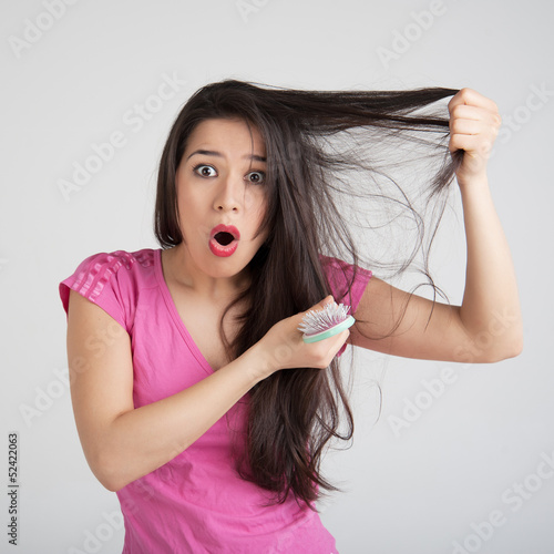 Loss hair comb in women hand