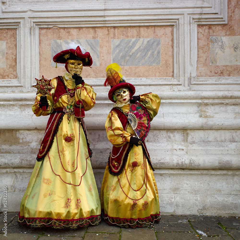 Venetian costume attends Carnival of Venice.