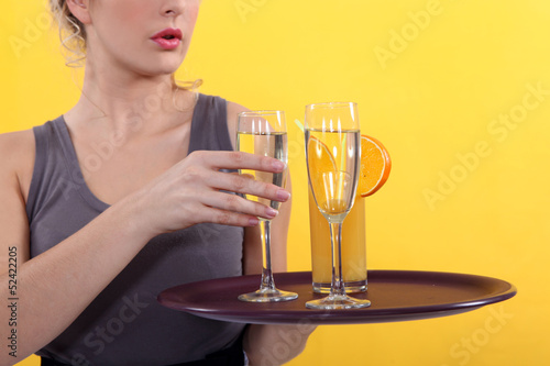 Casual waitress with a tray of drinks photo