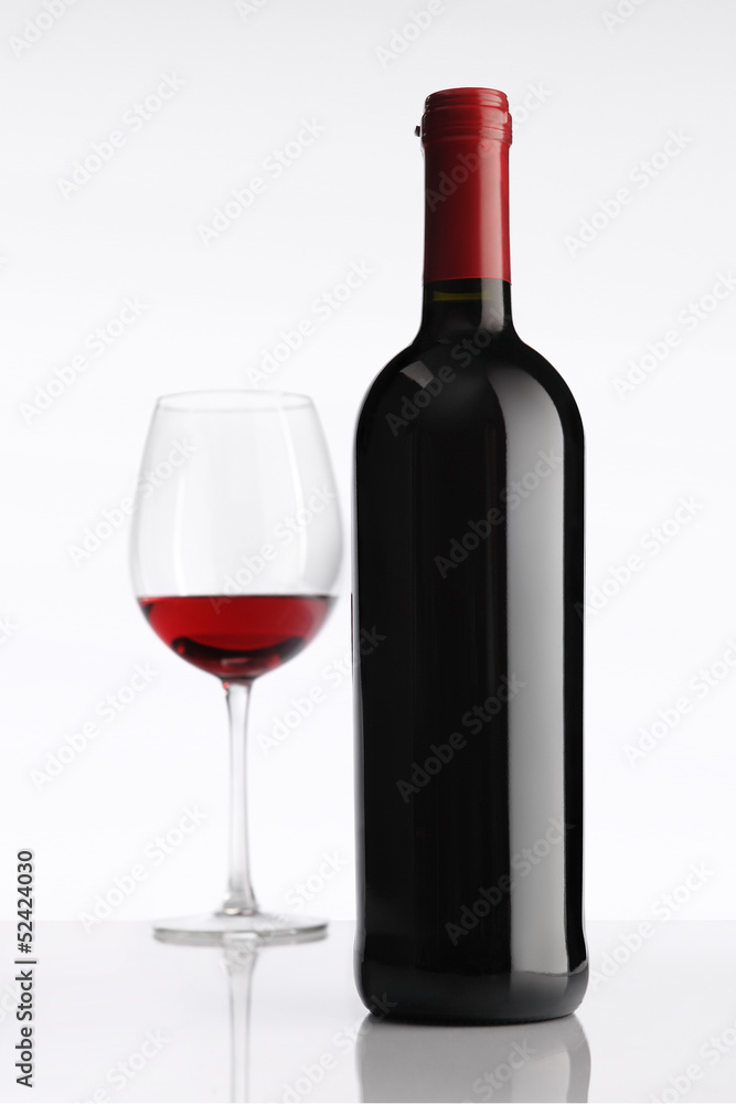 glass with red wine bottle on white background glass with red wine bottle on white background