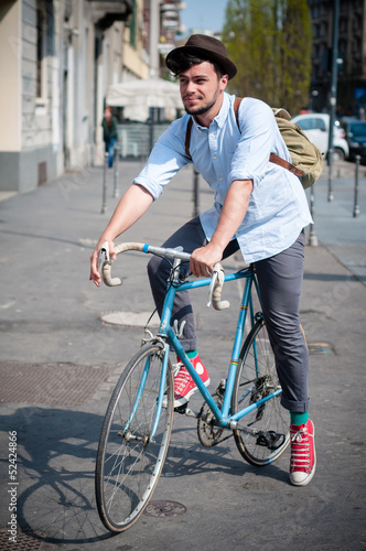 hipster young man on bike