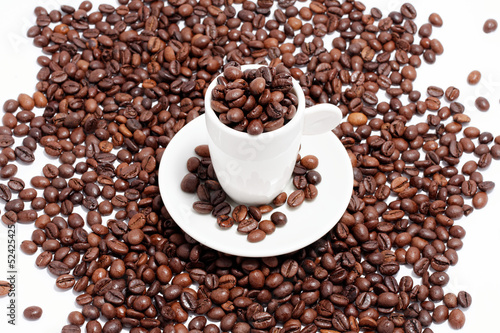 a cup of coffee beans on white background