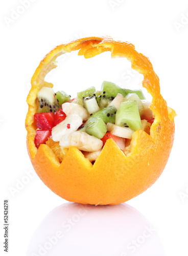 Fruit salad in hollowed-out orange isolated on white