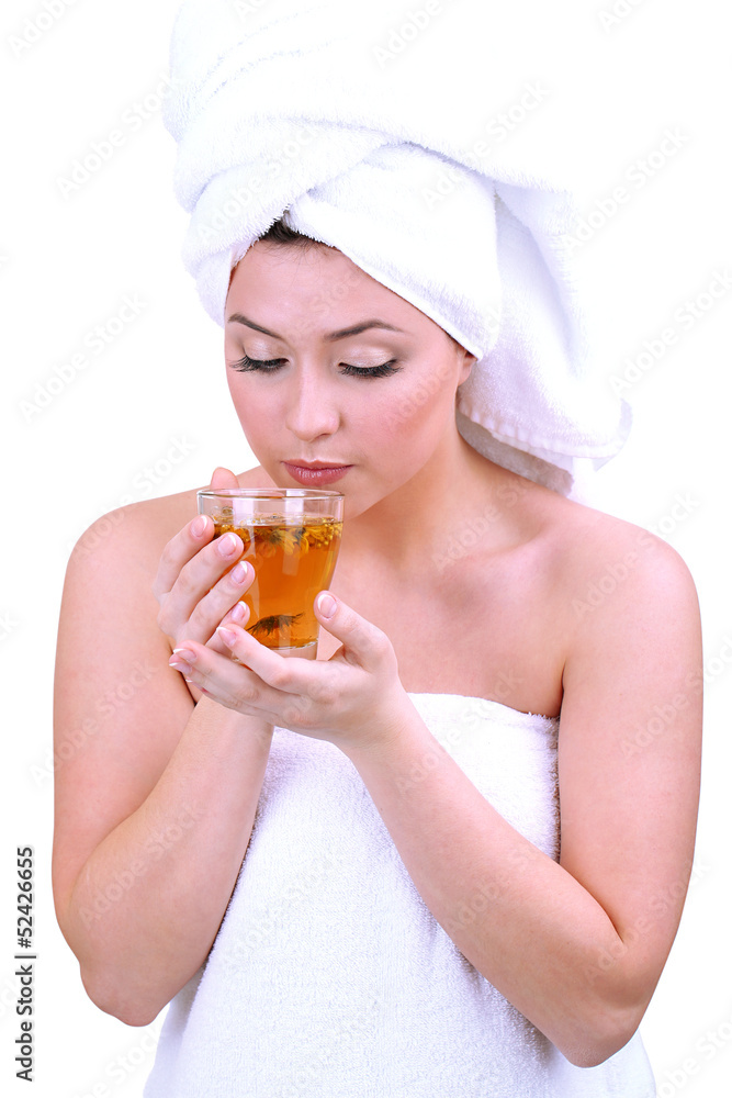 Beautiful young woman with cup of herbal tea isolated on white Beautiful young woman with cup of herbal tea isolated on white
