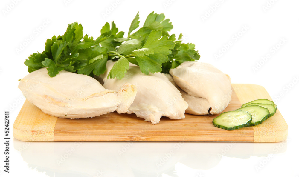 Boiled chicken breast on wooden cutting board isolated on white Boiled chicken breast on wooden cutting board isolated on white