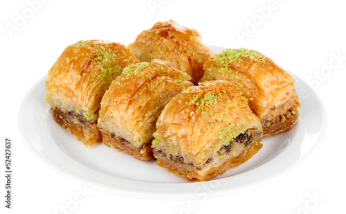 Sweet baklava on plate isolated on white photo