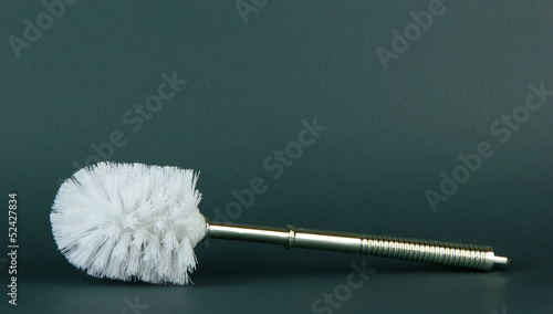 Toilet brush on grey background