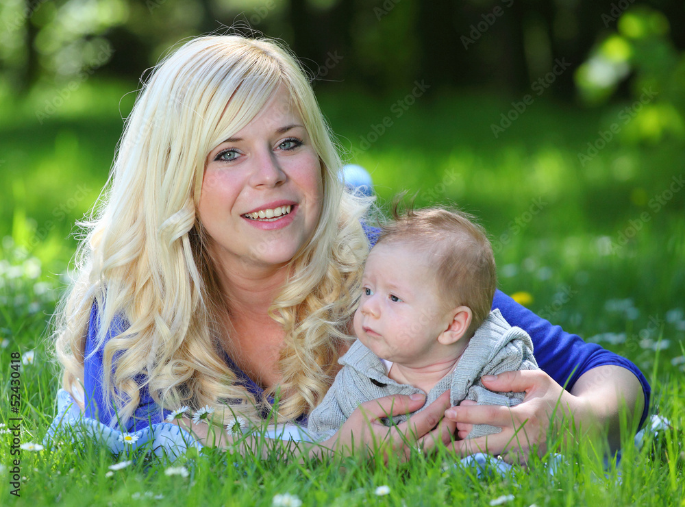 Young mother with little boy in the park together. Young mother with little boy in the park together.