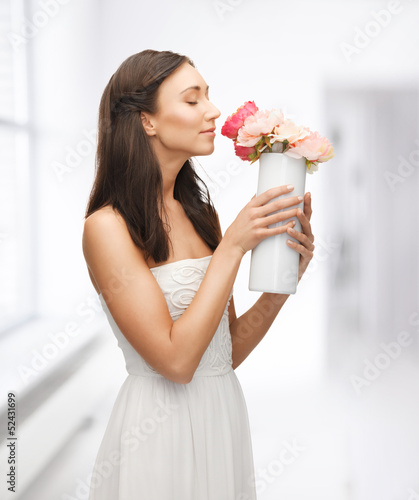 woman with vase of flowers