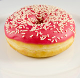 Pink donut on the plate