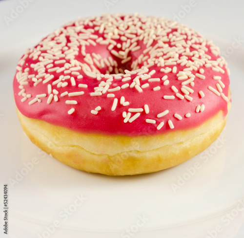 Pink donut on the plate