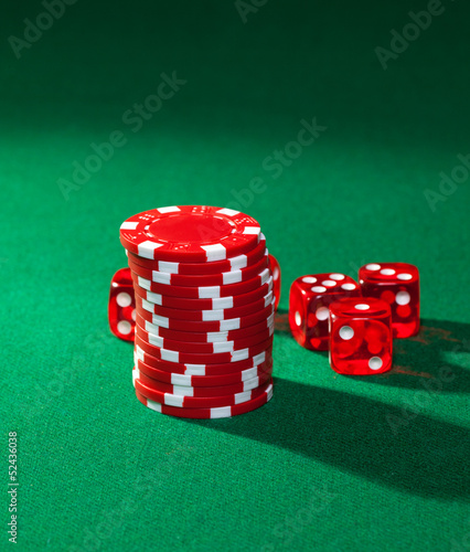 Fotografie Red poker chips and red dice