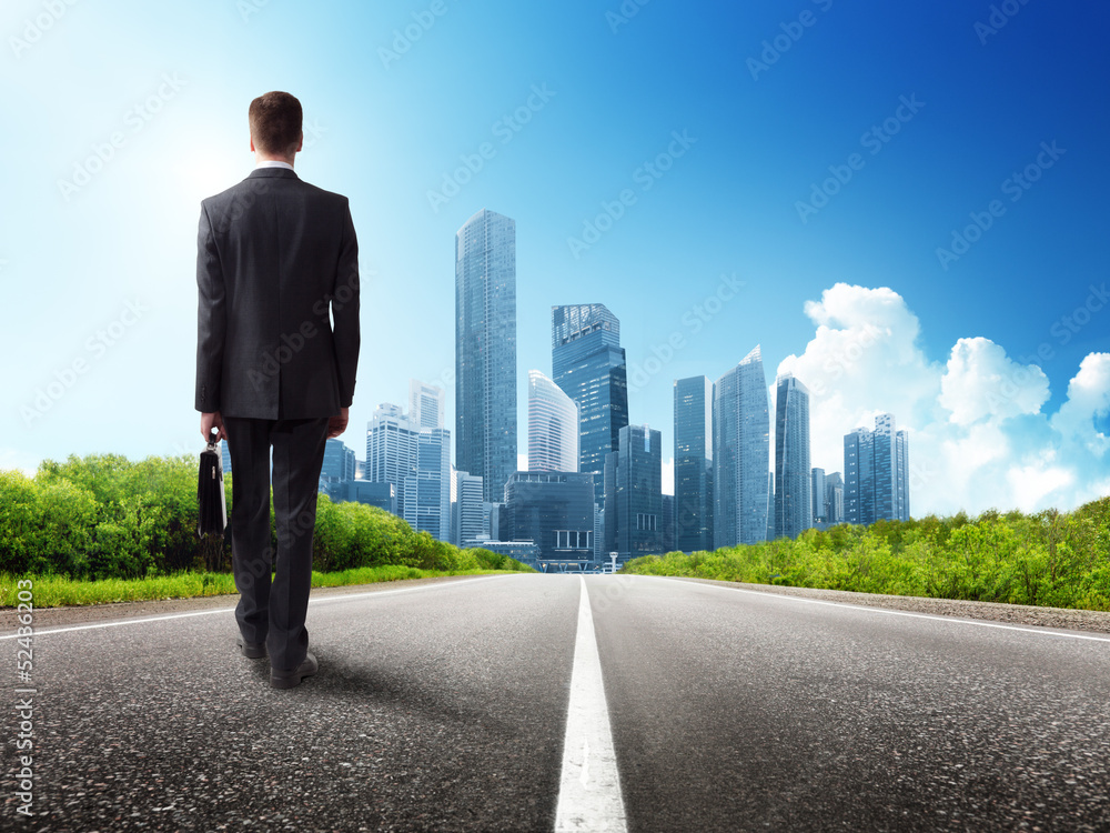 business man walking on the road business man walking on the road